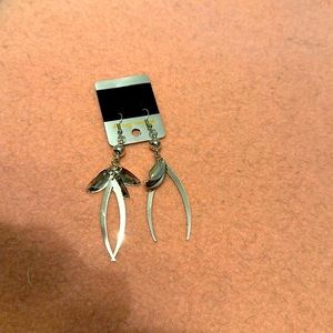 Beautiful brand-new earrings never worn- they are silver and they dangle